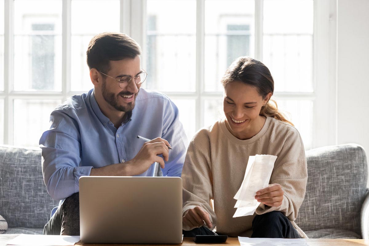 Smiling couple budgeting