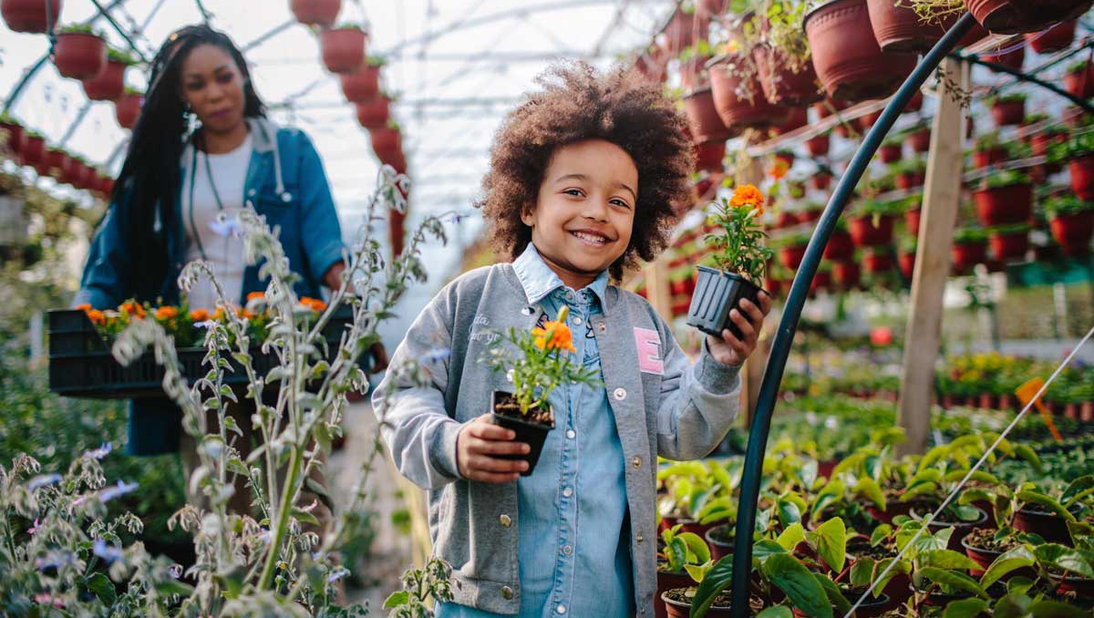 Mother and son with plants